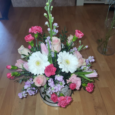 A Little Something - Show your affection with this mouth-watering mix of classical flowers delivered in a delightful gift bag or box.